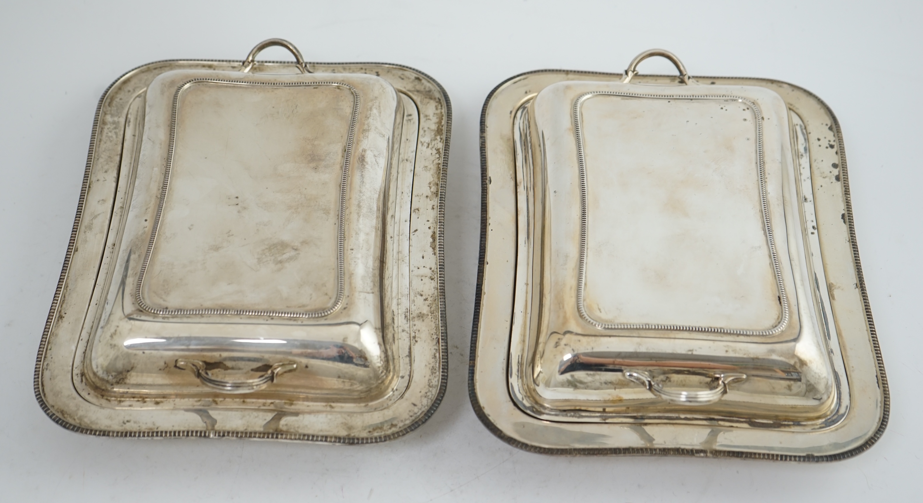 A pair of 1930's silver entrée dishes and covers, by Roberts & Belk